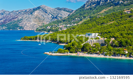 Stunning Makarska Riviera beach resort nestled between pine forests and dramatic Biokovo mountain range in Croatia Stunning Makarska Riviera beach resort nestled between pine forests and dramatic Biokovo mountain range in Croatia 132169595