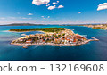 Spectacular aerial view of Primosten old town peninsula surrounded by crystal turquoise Adriatic Sea in Croatia 132169608
