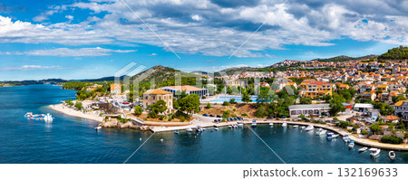 Beautiful aerial view of Sibenik coastal town with traditional Mediterranean architecture and turquoise Adriatic Sea waters Beautiful aerial view of Sibenik coastal town with traditional Mediterranean architecture and turquoise Adriatic Sea waters 132169633