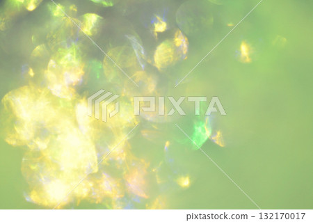 Abstract light background decoration. Fantastic light effect like sunlight filtering through the trees. Sparkle, sparkle, circular bokeh. 132170017