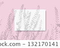 Natural light casts the shadow of field grass on a horizontal sheet of textured white paper on a pink table background. Mockup 132170141