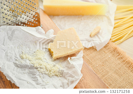 Parmigiano Reggiano powdered cheese 132171258