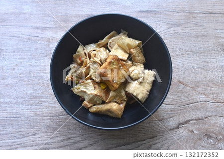 fried slice yellow tofu and gypsum with celery in soy sauce vegetarian food on bowl fried slice yellow tofu and gypsum with celery in soy sauce vegetarian food on bowl 132172352