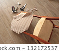 Restore old vintage chair in home. Fabric replacement. Antique furniture and modern striped linen and cotton fabric. Hobbies, crafts, and retro-minimalist style. 132172537