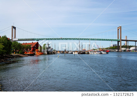 Suspension Alvsborg bridge over Gota river connecting Hisingen island with mainland near Eriksberg and Majorna area in Gothenburg, Sweden, sunny summer day Suspension Alvsborg bridge over Gota river connecting Hisingen island with mainland near Eriksberg and Majorna area in Gothenburg, Sweden, sunny summer day 132172625