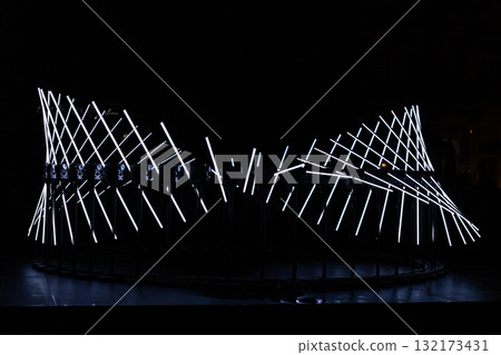 The fascinating night scene captures a modern light installation that dominates the space with a futuristic aesthetic and consists  132173431