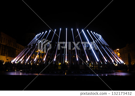 The fascinating night scene captures a modern light installation that dominates the space with a futuristic aesthetic and consists The fascinating night scene captures a modern light installation that dominates the space with a futuristic aesthetic and consists 132173432