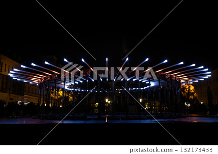 The fascinating night scene captures a modern light installation that dominates the space with a futuristic aesthetic and consists The fascinating night scene captures a modern light installation that dominates the space with a futuristic aesthetic and consists 132173433