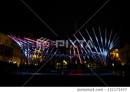 The fascinating night scene captures a modern light installation that dominates the space with a futuristic aesthetic and consists The fascinating night scene captures a modern light installation that dominates the space with a futuristic aesthetic and consists 132173437
