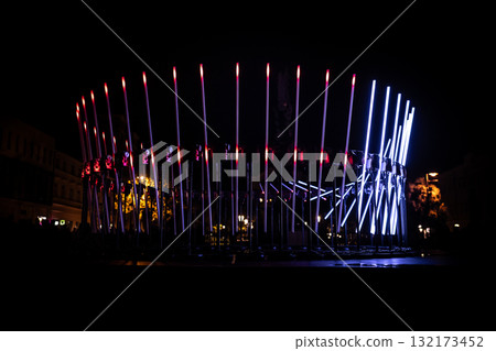 The fascinating night scene captures a modern light installation that dominates the space with a futuristic aesthetic and consists The fascinating night scene captures a modern light installation that dominates the space with a futuristic aesthetic and consists 132173452