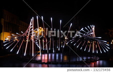 The fascinating night scene captures a modern light installation that dominates the space with a futuristic aesthetic and consists  132173456