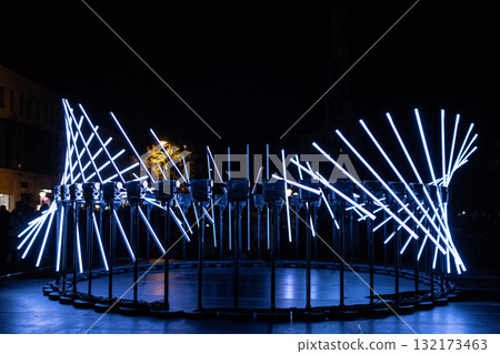 The fascinating night scene captures a modern light installation that dominates the space with a futuristic aesthetic and consists  132173463