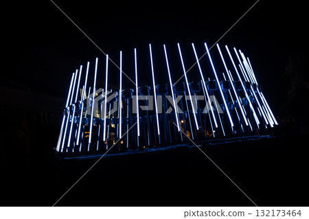 The fascinating night scene captures a modern light installation that dominates the space with a futuristic aesthetic and consists  132173464