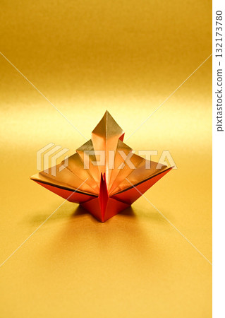 Folded cranes on a golden background Folded cranes on a golden background 132173780