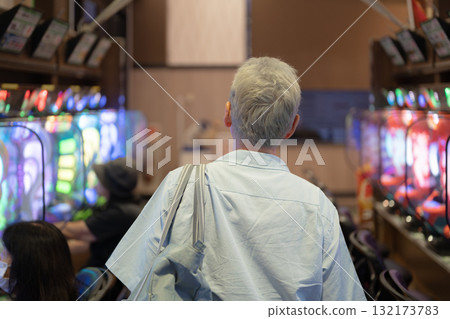 Men enjoying pachinko 132173783