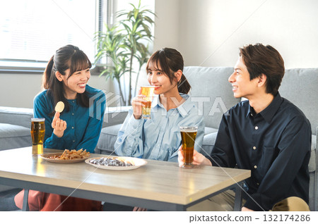 Three men and women having a drinking party 132174286