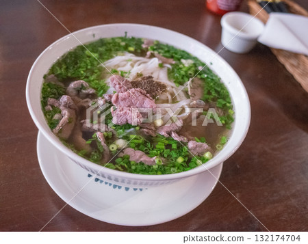 [Poland] Pho on a table at a Vietnamese restaurant in downtown Warsaw 132174704