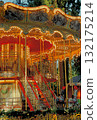 Christmas carousel with horses on the square in the city 132175214