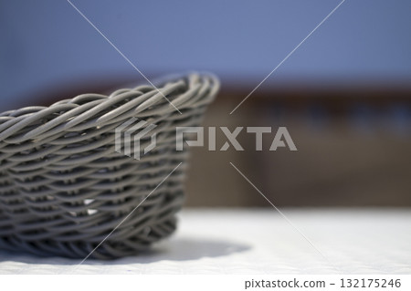 Artificial wicker basket on the table in the cafe. 132175246