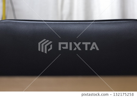 The background is made of black artificial leather. 132175258