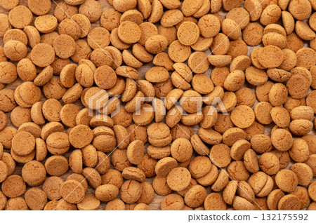 Background Dutch holiday Sinterklaas with copy space for text. Kruidnoten cookies and traditional hollands sweets. Background Dutch holiday Sinterklaas with copy space for text. Kruidnoten cookies and traditional hollands sweets. 132175592