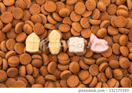 Background Dutch holiday Sinterklaas with copy space for text. Kruidnoten cookies and traditional hollands sweets. Background Dutch holiday Sinterklaas with copy space for text. Kruidnoten cookies and traditional hollands sweets. 132175593