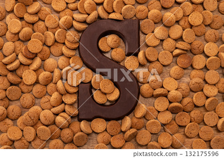 Background Dutch holiday Sinterklaas with copy space for text. Kruidnoten cookies and traditional hollands sweets. Background Dutch holiday Sinterklaas with copy space for text. Kruidnoten cookies and traditional hollands sweets. 132175596