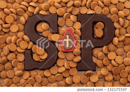 Background Dutch holiday Sinterklaas with copy space for text. Kruidnoten cookies and traditional hollands sweets. 132175597