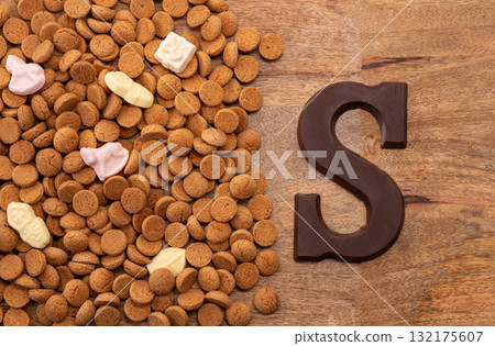 Background Dutch holiday Sinterklaas with copy space for text. Kruidnoten cookies and traditional hollands sweets. Background Dutch holiday Sinterklaas with copy space for text. Kruidnoten cookies and traditional hollands sweets. 132175607