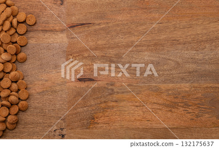 Background Dutch holiday Sinterklaas with copy space for text. Kruidnoten cookies and traditional hollands sweets. Background Dutch holiday Sinterklaas with copy space for text. Kruidnoten cookies and traditional hollands sweets. 132175637