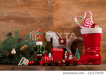 Saint Nicholas Day or Nikolaus, german holiday, December 6. Children toys and shoes with traditional sweets. 132175659