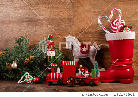 Saint Nicholas Day or Nikolaus, german holiday, December 6. Children toys and shoes with traditional sweets. 132175661