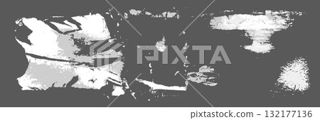 Collection of white shreds from torn and ripped paper with glue residues adhering to a wall Collection of white shreds from torn and ripped paper with glue residues adhering to a wall 132177136