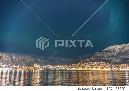 Tromso Norway, aurora borealis northern lights at city sentrum skyline harbor Tromso Norway, aurora borealis northern lights at city sentrum skyline harbor 132178261