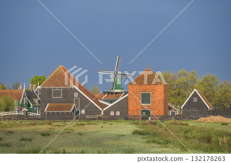 Dutch Windmill and traditional house at Zaanse Schans Village, Amsterdam Netherlands 132178263