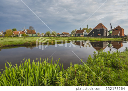 Dutch Windmill and traditional house at Zaanse Schans Village, Amsterdam Netherlands 132178264