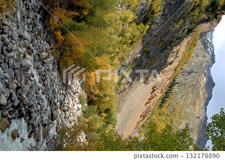 A river flowing through the Chalaadi Glacier valley in the Caucasus Mountains. Mestia, Svaneti, Georgia. 132178890