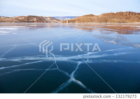 Lake Baikal in December. View of the frozen Kurkut Bay Lake Baikal in December. View of the frozen Kurkut Bay 132179273