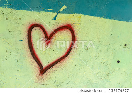 Spray painted red heart on rough pastel wall, bold contrast and raw emotional message in urban setting. Concept of heart symbol, Valentine vibe, love expression in street art Spray painted red heart on rough pastel wall, bold contrast and raw emotional message in urban setting. Concept of heart symbol, Valentine vibe, love expression in street art 132179277