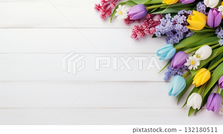 Pretty spring flowers on white wooden background with copy space for your design. Spring background concept 132180511