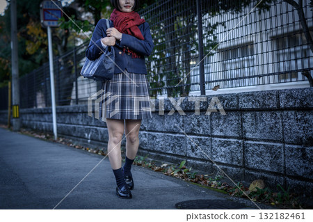 High school girls walking to and from school on a dark road on a cold day. High school girls' skirts, club activities, supplementary classes, going to and from school, negative image High school girls walking to and from school on a dark road on a cold day. High school girls' skirts, club activities, supplementary classes, going to and from school, negative image 132182461