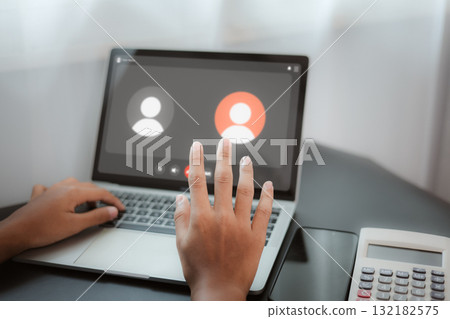 Online Video Call and Remote Meeting Communication on Laptop 132182575