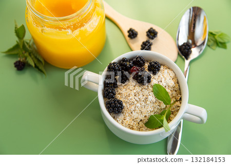 Bowl with dry cereal and berries on the background 132184153
