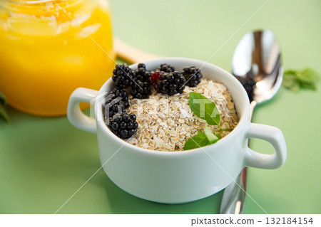 Diet food from oatmeal and fresh fruits Diet food from oatmeal and fresh fruits 132184154