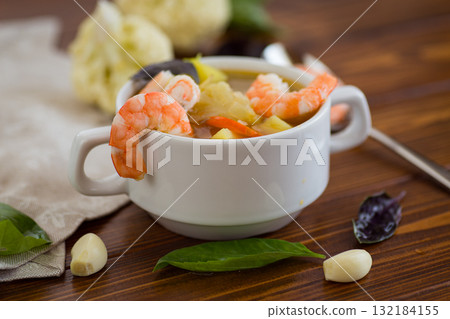 Tender Seafood Soup with Potatoes and Carrots Tender Seafood Soup with Potatoes and Carrots 132184155