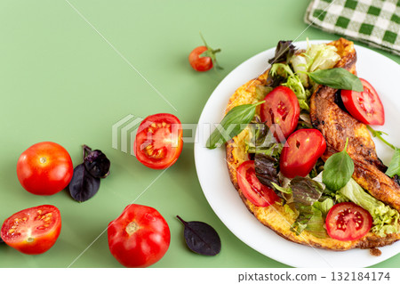 Fitness dish omelette with arugula, spinach and sweet pepper 132184174