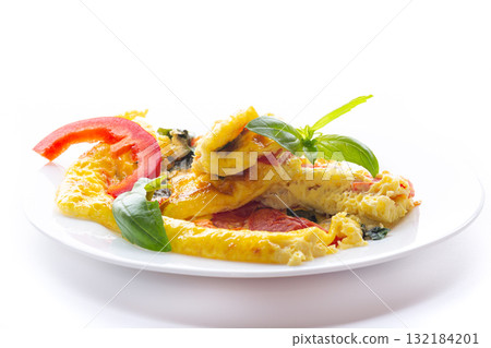 Fried eggs for breakfast with vegetables and herbs, isolated on white 132184201
