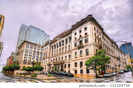 The Clarence M. Mitchell, Jr. Courthouse in downtown Baltimore, Maryland, United States. This historic Beaux-Arts building is seen on a cloudy, rainy day with wet streets reflecting the overcast sky 132184756
