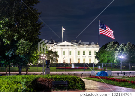 The White House, the official residence of the U.S. President, viewed from Lafayette Square in Washington, D.C. The historic neoclassical building with a United States flag are illuminated at night The White House, the official residence of the U.S. President, viewed from Lafayette Square in Washington, D.C. The historic neoclassical building with a United States flag are illuminated at night 132184764