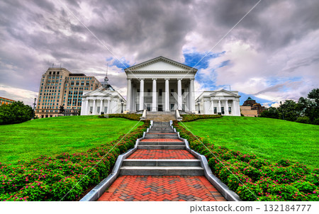 The Virginia State Capitol in Richmond, Virginia, USA. The historic neoclassical landmark is viewed from its grand entrance stairway under a dramatic, cloudy sky 132184777